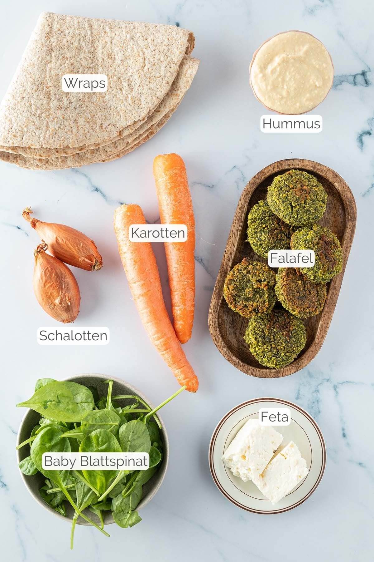 Foto aller Zutaten mit jeweiligen Textbeschriftungen, die f&uuml;r Falafel Wraps ben&ouml;tigt werden.