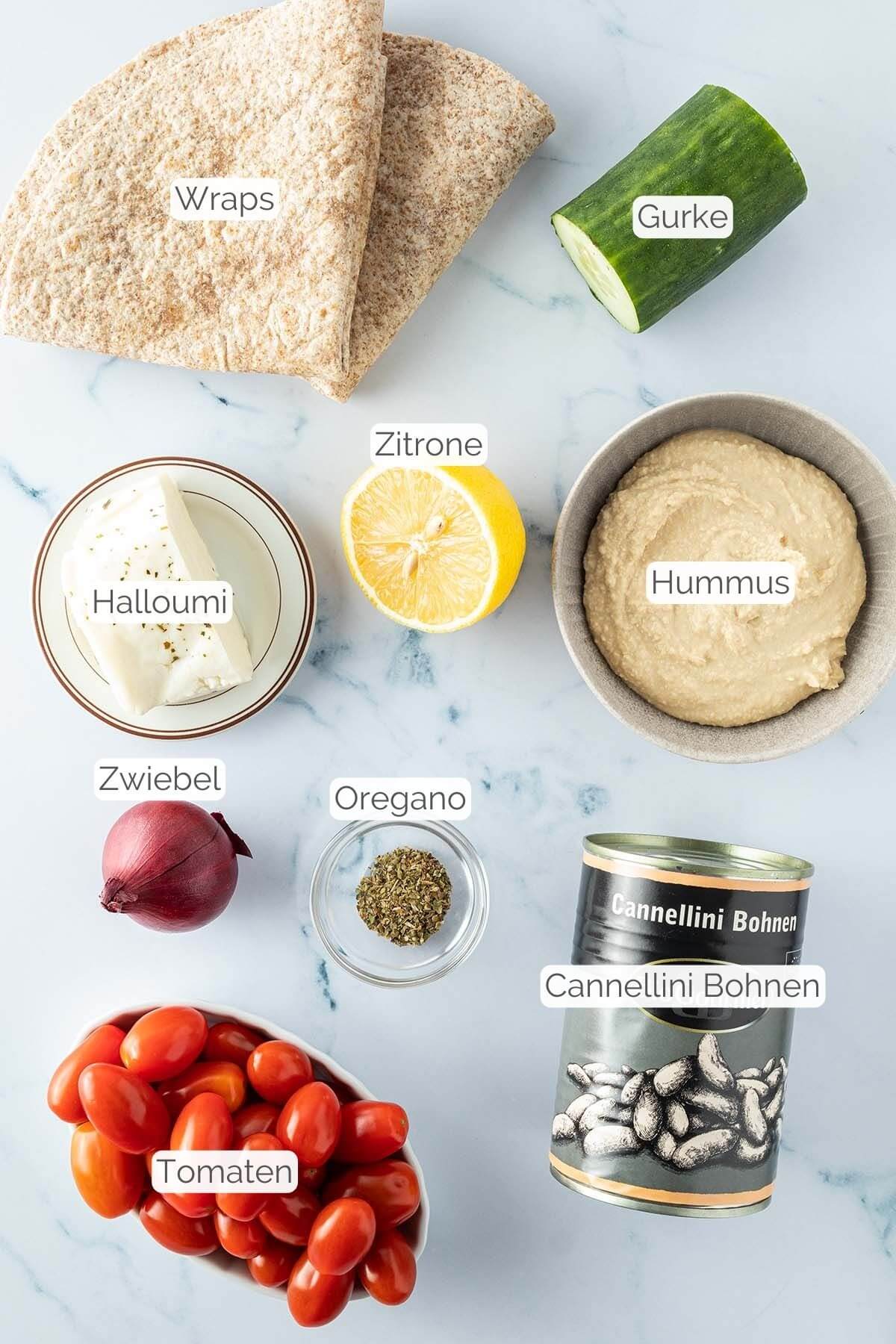 Foto aller Zutaten mit jeweiligen Textbeschriftungen, die f&uuml;r den Halloumi-Wrap ben&ouml;tigt werden.